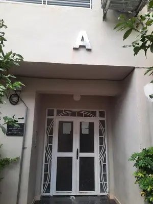 a sign above a door with a number above it at Appartement Moderne & Cosy in Fès