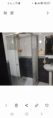 a bathroom with a shower and a sink and a toilet at واد فاس in Douar Trhaïtia