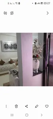a picture of a room with a vase of flowers at واد فاس in Douar Trhaïtia