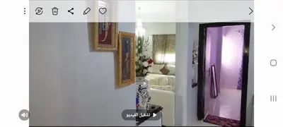 a room with a vase of flowers on a wall at واد فاس in Douar Trhaïtia