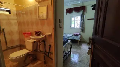 a bathroom with a toilet and a sink at Hotel Oasis Tinghir in Tinerhir