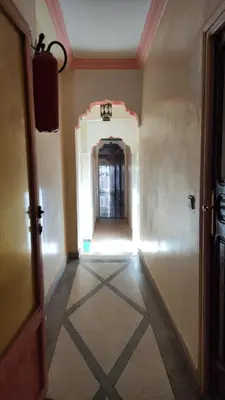 an empty hallway with a room with a tile floor at Hotel Oasis Tinghir in Tinerhir