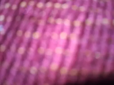a close up of a pink blanket at erg sahara merzouga in Ouzina