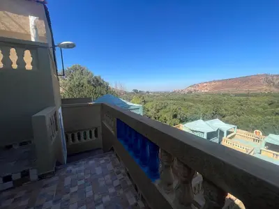 a balcony with a view of the mountains at Extrait d'atlas in Tafza