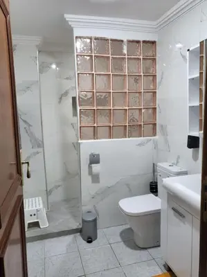 a bathroom with a shower and a toilet and a sink at Votre havre de paix à Ifrane in Ifrane