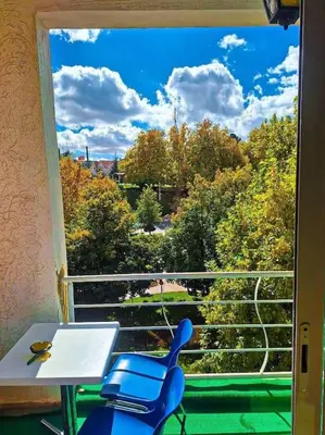 a room with a table and two chairs and a window at Votre havre de paix à Ifrane in Ifrane