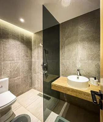 a bathroom with a sink and a shower and a toilet at CASA ULIVO villa en pleine nature in Dar Caïd Bou Driss