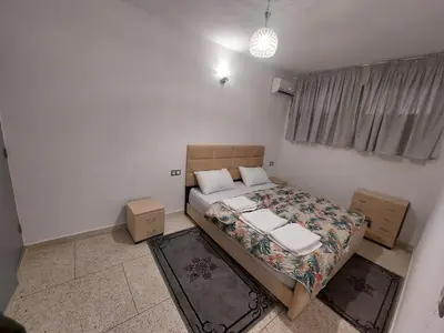 a small bedroom with a bed and a window at New feeling maison climatisée in Ville Nouvelle