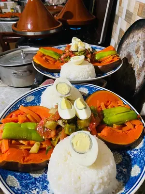 a plate of food with rice and vegetables on it at Youssef Rezki Taghia in Taghia