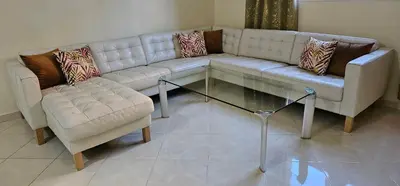 a living room with a couch and a coffee table at Diar Kamiliya Meknès in Meknès