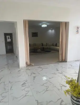 a living room with a couch and a marble floor at Luxury Villa With Large Private Pool in Marrakech