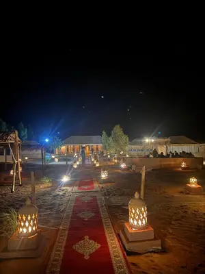 a group of lights on a road at night at Ksar Merzouga in Merzouga