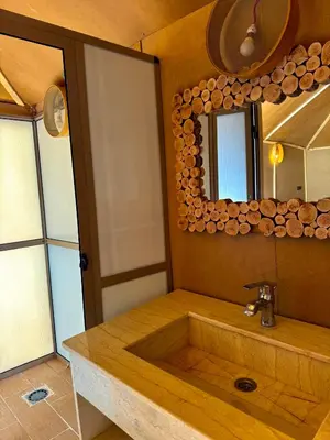a bathroom with a sink and a mirror at Ksar Merzouga in Merzouga