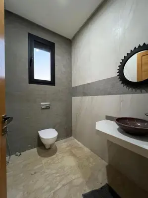 a bathroom with a toilet and a sink at Elite Villa on the Road to Fes in Marrakech