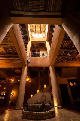 a view of a large building with a wooden ceiling at Dar Kamar in Ouarzazate