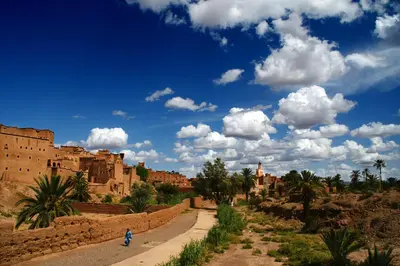 a person walking down a street in a city at Dar Kamar in Ouarzazate