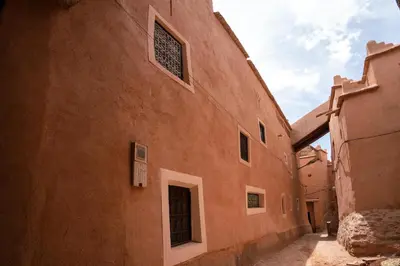 an orange building with windows on the side of it at Dar Kamar in Ouarzazate