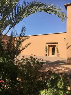 a building with an archway in front of it at Ryad-IGRANE in Ouarzazate