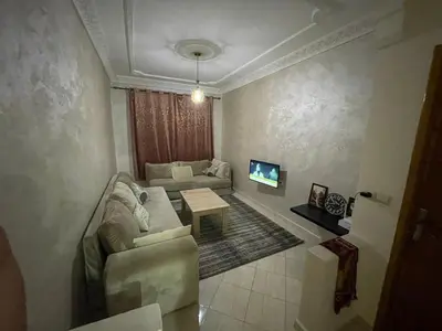 a living room with a couch and a table at Welcome1 in Meknès