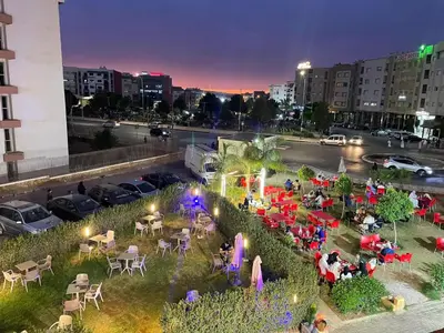 an overhead view of a park with tables and chairs at Welcome1 in Meknès