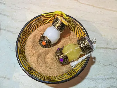 two vases on a plate on a table at Royal Sahara Dome Camp in Merzouga