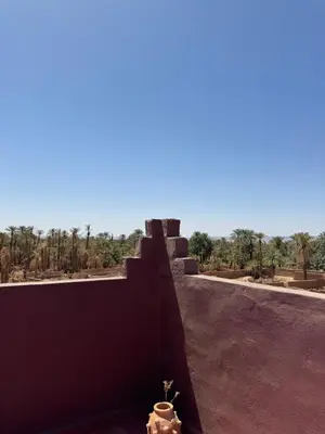 a fire hydrant sitting on the side of a building at Apparemment de luxe avec terrasse privée in Zagora