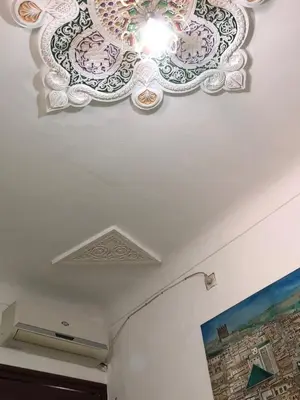 a ceiling in a room with a painted ceiling at Dar Lalla Wafae in Fès