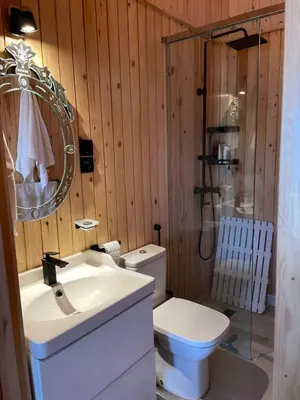 a bathroom with a sink and a toilet and a mirror at Scandinavian Chalet in the Atlas Mountains - Ifrane in Ifrane