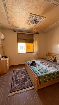 a bedroom with a bed and a ceiling at Rout ourika in Marrakech