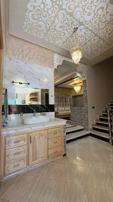 a large bathroom with a sink and a staircase at Rout ourika in Marrakech