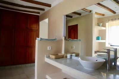 a bathroom with a large bowl sink on a counter at Villa Beldi Chic Novari avec piscine chauffée - 8 personnes - Marrakech - Petit déjeuner inclus in Douarbel Kial