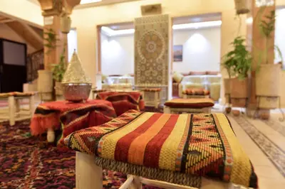 a living room with a couch and a table at Dar Chams Ouarzazate in Ouarzazate