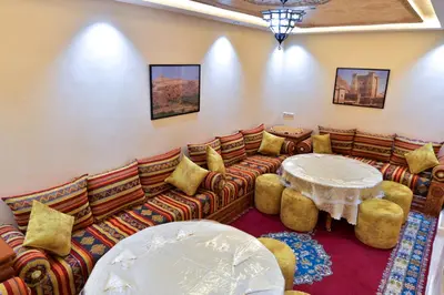 a living room with a couch and a table at Dar Chams Ouarzazate in Ouarzazate