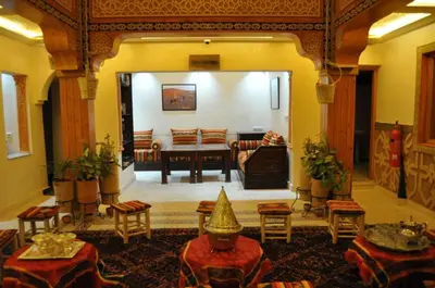 a large living room with a table and chairs at Dar Chams Ouarzazate in Ouarzazate