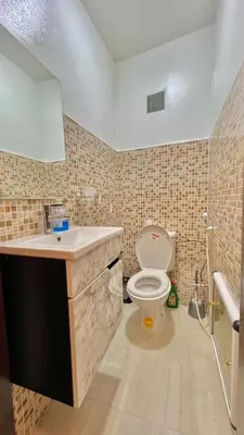 a bathroom with a toilet and a sink at Joli appartement in Fès