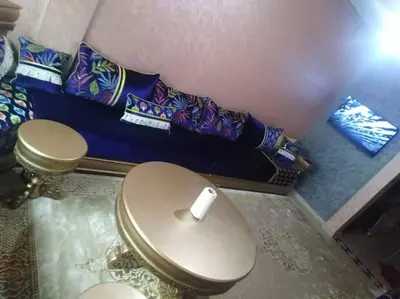 a bathroom with a toilet with pillows on the floor at Top 4 Rooms Apartment in Beni Mellal