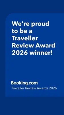 a blue sign that says were proud to be a traveller reviewagency winner at Apartment Oued Fes close to Euromed in Fès
