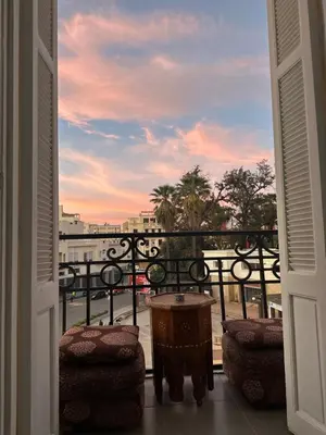 a view of a balcony with a table and chairs at Chez Mia in Fès