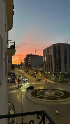 a view of a city street with traffic at sunset at Chez Mia in Fès