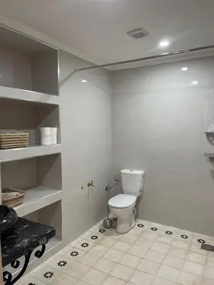 a bathroom with a toilet in a room at Appartement Fatima in Azrou