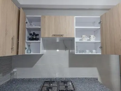 a kitchen with a stove top in a kitchen at Golden Mirage in Fès