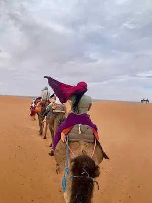 a group of people riding horses in the desert at Expérience Inoubliable dans une Tente de Luxe en plein Désert de Merzouga ! in Merzouga