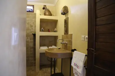 a bathroom with a sink and a shower at Dar El Mandar - Ferme & Table d'Hôte Berbère in Bhalil