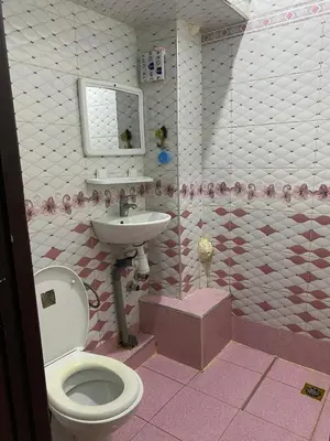 a bathroom with a toilet and a sink at Wafae in Meknès