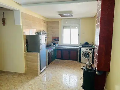 a kitchen with a refrigerator and a stove in it at Zen environnement Horse riding in Zaouia dʼIfrane