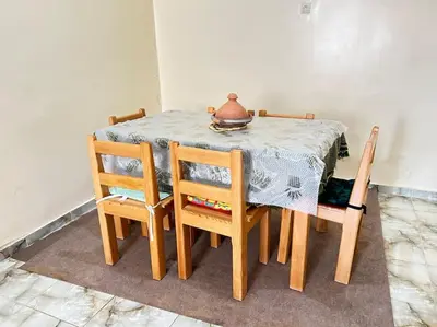 a table with a pot sitting on top of it at Coquet F2 Jnane el Atlas Ifrane in Zaouia dʼIfrane