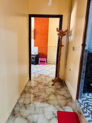 a hallway with a room with a marble floor at Coquet F2 Jnane el Atlas Ifrane in Zaouia dʼIfrane