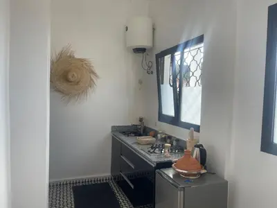 a bathroom with a sink and a mirror at Studio Yasmine in Azrou