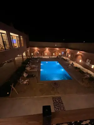 an overhead view of a swimming pool at night at Rose Garden Dades in Kalaat MGouna