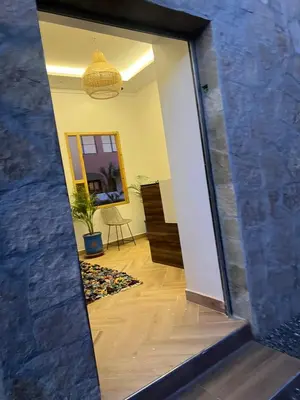 a mirror reflection of a hallway with a room at Rose Garden Dades in Kalaat MGouna